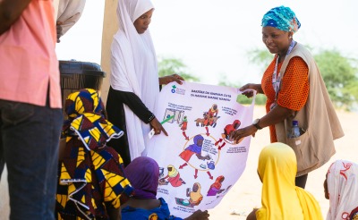 Action Against Hunger staff host a hygiene education session for displaced families in Nigeria.